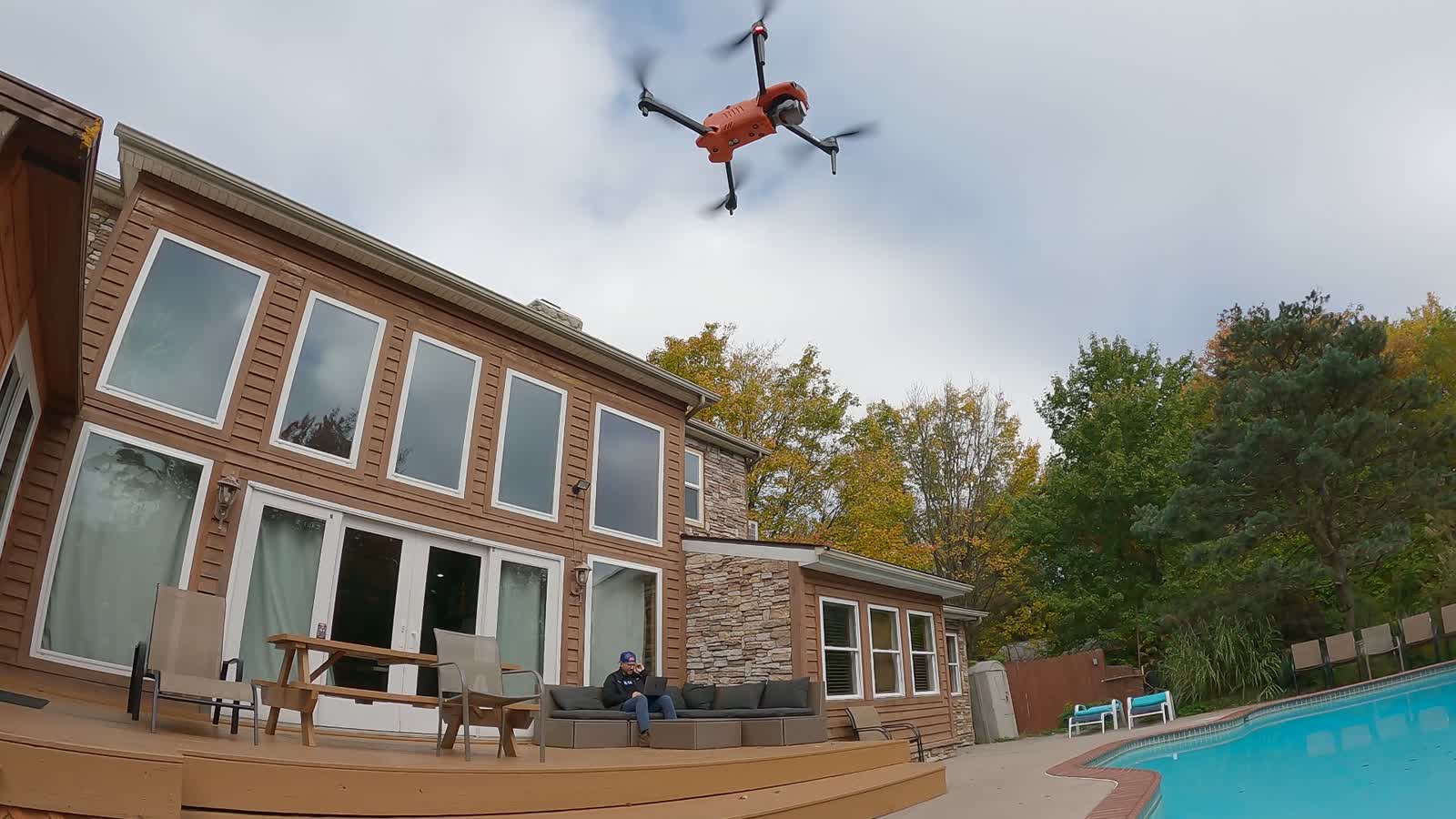 Autel EVO II Pro drone hovering over a backyard deck